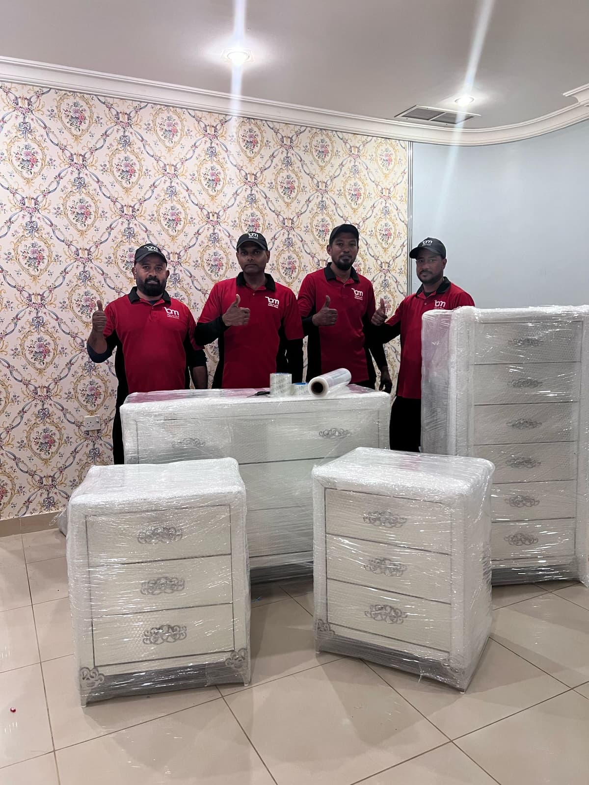 men packing furniture