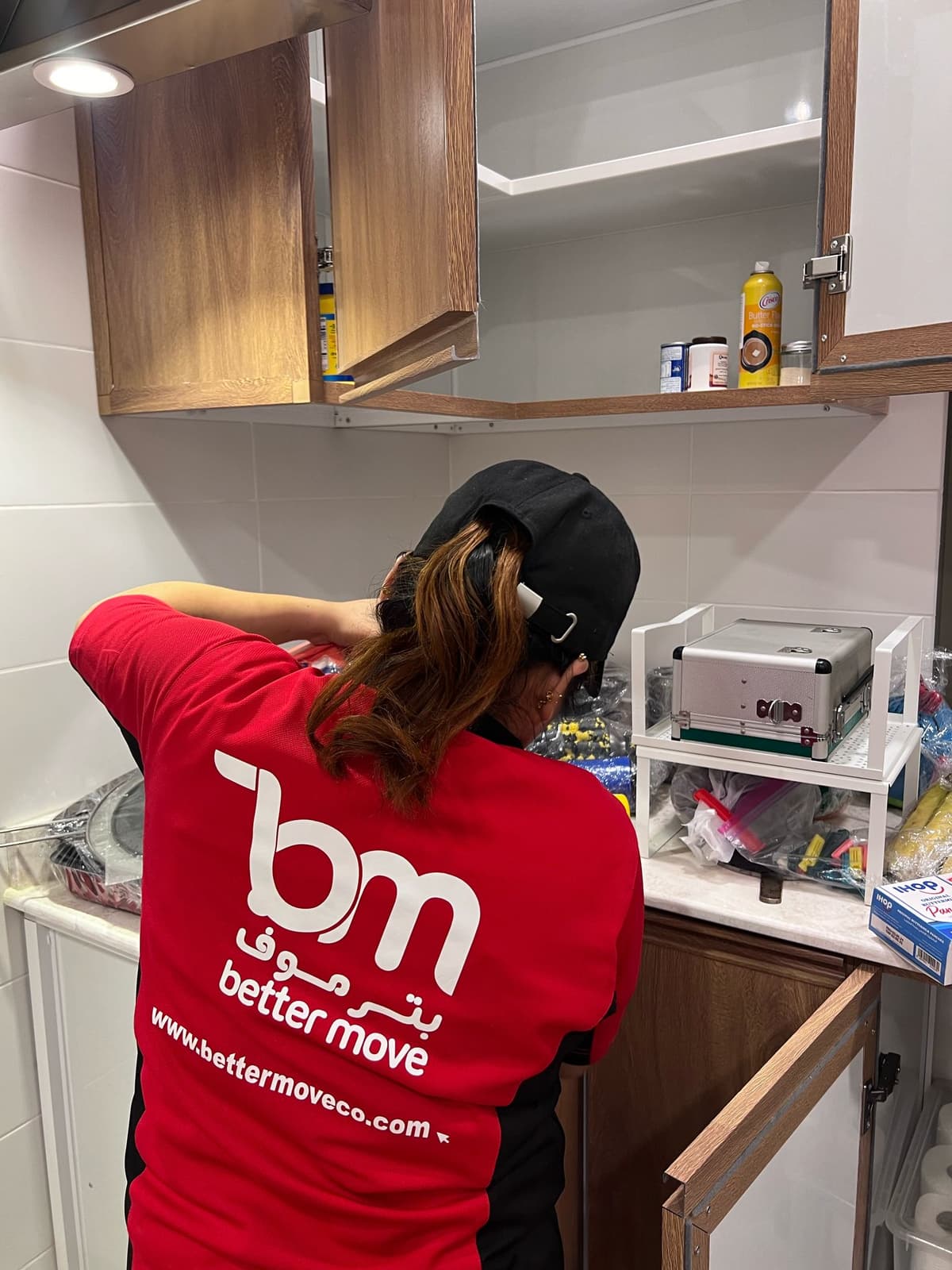 lady organizing stuff in the kitchen
